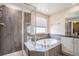 Bathroom with walk-in shower and soaking tub at 20052 W 95Th Pl, Arvada, CO 80007