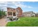 Spacious backyard with fire pit and patio, ideal for outdoor entertaining at 20052 W 95Th Pl, Arvada, CO 80007