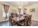 Formal dining room with wood table and wine cooler at 20052 W 95Th Pl, Arvada, CO 80007