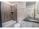 Clean bathroom with modern vanity, shower, and bathtub at 20052 W 95Th Pl, Arvada, CO 80007