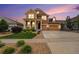 Two-story house with attached garage and front yard at 20052 W 95Th Pl, Arvada, CO 80007