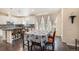 Spacious kitchen with island, granite countertops, and white cabinets at 20052 W 95Th Pl, Arvada, CO 80007