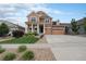 Two-story house with attached garage and front yard at 20052 W 95Th Pl, Arvada, CO 80007