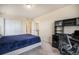 Bedroom with a desk and double door closet at 20052 W 95Th Pl, Arvada, CO 80007