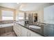 Bathroom with double vanity, soaking tub, and walk-in shower at 20052 W 95Th Pl, Arvada, CO 80007