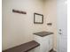Convenient laundry room with built-in bench and cabinets at 20052 W 95Th Pl, Arvada, CO 80007