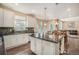 Modern kitchen featuring a large island and stainless steel appliances at 20052 W 95Th Pl, Arvada, CO 80007