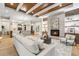 Living area with hardwood floors, fireplace, and coffered ceiling at 6571 S Harlan Ct, Littleton, CO 80123