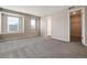 Large bedroom with neutral walls, carpet, and walk-in closet at 17574 Rose Heath Rd, Parker, CO 80134