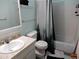 Clean bathroom with a shower/tub combo, toilet and vanity at 1165 Milky Way, Thornton, CO 80260