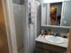 Clean bathroom with a shower/tub combo, vanity, and mirror at 1165 Milky Way, Thornton, CO 80260