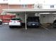 Covered parking spaces for residents with snow on the ground at 1165 Milky Way, Thornton, CO 80260