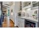 Well-appointed butler's pantry with built-in appliances and wine cooler at 1210 Wildcat Bend Ct, Castle Rock, CO 80108