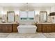 Luxurious bathroom with double vanity, soaking tub, and elegant fixtures at 1210 Wildcat Bend Ct, Castle Rock, CO 80108