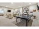 Finished basement recreation room with ping pong table and seating at 1210 Wildcat Bend Ct, Castle Rock, CO 80108