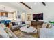 Gathering room with hardwood floors and views of kitchen at 1210 Wildcat Bend Ct, Castle Rock, CO 80108
