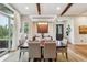 Elegant dining room with hardwood floors and large windows at 1210 Wildcat Bend Ct, Castle Rock, CO 80108