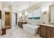 Spa-like bathroom featuring a freestanding tub and walk-in shower at 1210 Wildcat Bend Ct, Castle Rock, CO 80108