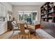 Home office with built-in shelving, large windows, and hardwood floors at 1210 Wildcat Bend Ct, Castle Rock, CO 80108