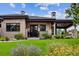 Craftsman style home with stone exterior and covered porch at 1210 Wildcat Bend Ct, Castle Rock, CO 80108