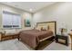 Spacious bedroom with plush carpet and large window at 1210 Wildcat Bend Ct, Castle Rock, CO 80108