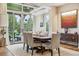 Elegant dining room with hardwood floors and large windows at 1210 Wildcat Bend Ct, Castle Rock, CO 80108