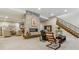 Finished basement featuring a stone fireplace and ample living space at 1210 Wildcat Bend Ct, Castle Rock, CO 80108