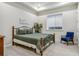 Comfortable basement bedroom with plush bedding and sitting area at 1210 Wildcat Bend Ct, Castle Rock, CO 80108