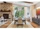 Elegant dining room with hardwood floors and large windows at 1210 Wildcat Bend Ct, Castle Rock, CO 80108