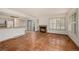 Living room with terracotta tile floors, a fireplace and kitchen at 13824 E Lehigh Ave # C, Aurora, CO 80014