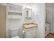 Clean bathroom with a toilet, sink, and vanity at 13824 E Lehigh Ave # C, Aurora, CO 80014