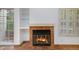 Fireplace with terracotta tile surround in the living room at 13824 E Lehigh Ave # C, Aurora, CO 80014