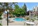 Community pool with plenty of lounge chairs and a patio area at 13824 E Lehigh Ave # C, Aurora, CO 80014