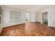 Open living area with terracotta tile floors and access to other rooms at 13824 E Lehigh Ave # C, Aurora, CO 80014