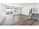 Spacious living room featuring hardwood floors and sliding glass doors at 8325 Butte Creek St, Littleton, CO 80125