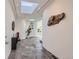 Modern entryway with slate tile flooring and unique wall art at 801 E Radcliff Ave, Englewood, CO 80113