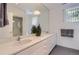 Modern bathroom with double vanity and marble countertops at 801 E Radcliff Ave, Englewood, CO 80113