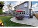 House's backyard with patio, lawn, and grill at 13745 W Amherst Way, Lakewood, CO 80228