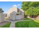 Townhouse exterior with landscaped yard at 8787 Yukon St, Arvada, CO 80005