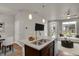 Open concept kitchen with island and living area view at 19733 W 93Rd Ln # D, Arvada, CO 80007
