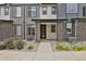 Modern townhome exterior with stone accents at 19733 W 93Rd Ln # D, Arvada, CO 80007