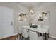 Elegant dining area with marble table and chandelier at 19733 W 93Rd Ln # D, Arvada, CO 80007