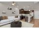 Open concept kitchen and living area with modern appliances at 19733 W 93Rd Ln # D, Arvada, CO 80007