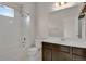 Clean bathroom with shower/tub combo, vanity, and window at 19733 W 93Rd Ln # D, Arvada, CO 80007