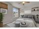 Bright bedroom with large window and ceiling fan at 19733 W 93Rd Ln # D, Arvada, CO 80007
