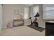 Home gym featuring Peloton exercise bike and other fitness equipment at 9071 Southurst St, Highlands Ranch, CO 80129