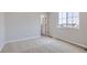 Well-lit bedroom featuring carpet, neutral walls, and a closet at 3025 Nectar Street St, Strasburg, CO 80136