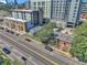 Aerial view of a city street with various buildings and a lot for sale at 3735 N Marion St, Denver, CO 80205