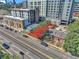 Aerial view of a city street with various buildings and a lot for sale at 3735 N Marion St, Denver, CO 80205