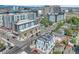 Aerial view of a city street with various buildings and a lot for sale at 3735 N Marion St, Denver, CO 80205